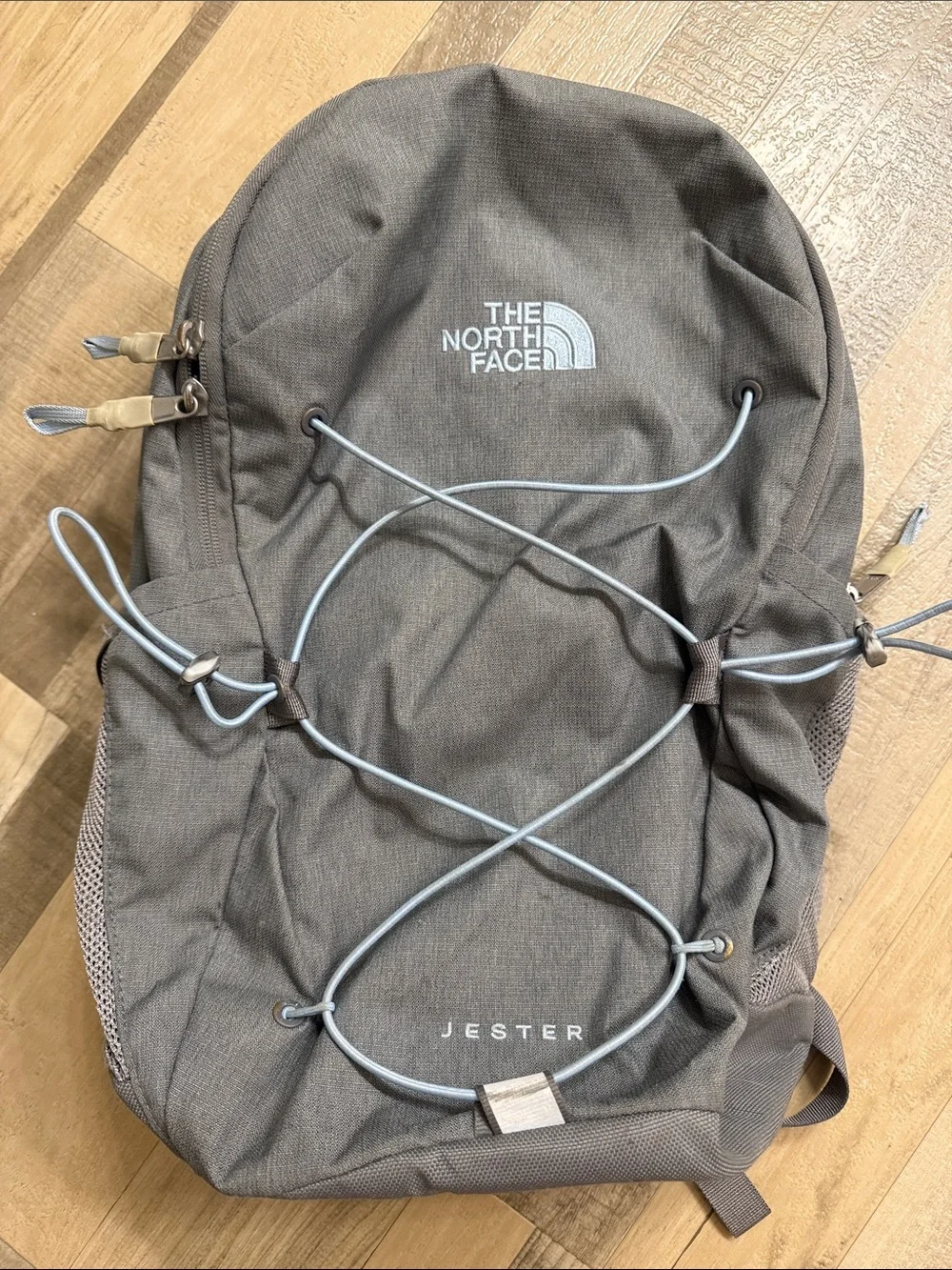 The North Face Jester Backpack in Grey with light blue Bungee